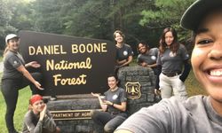 SECC Womens crew poses in front of Daniel Boone National Forest sign