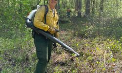 Photo of Aaron with a leaf blower