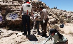 Ancestral Lands Crew Members remove graffiti